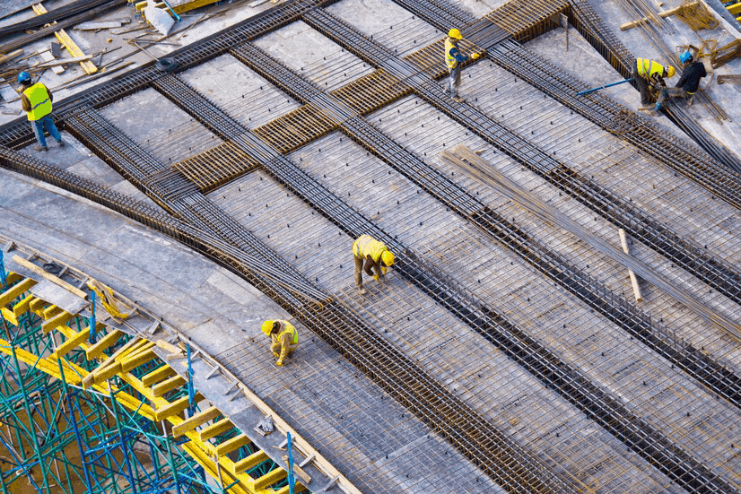 workers putting metal structure construction